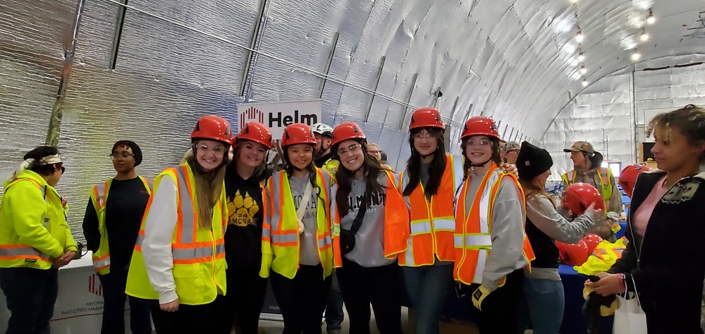 Ladies are ready for work! Safety helmet, glasses and work gloves